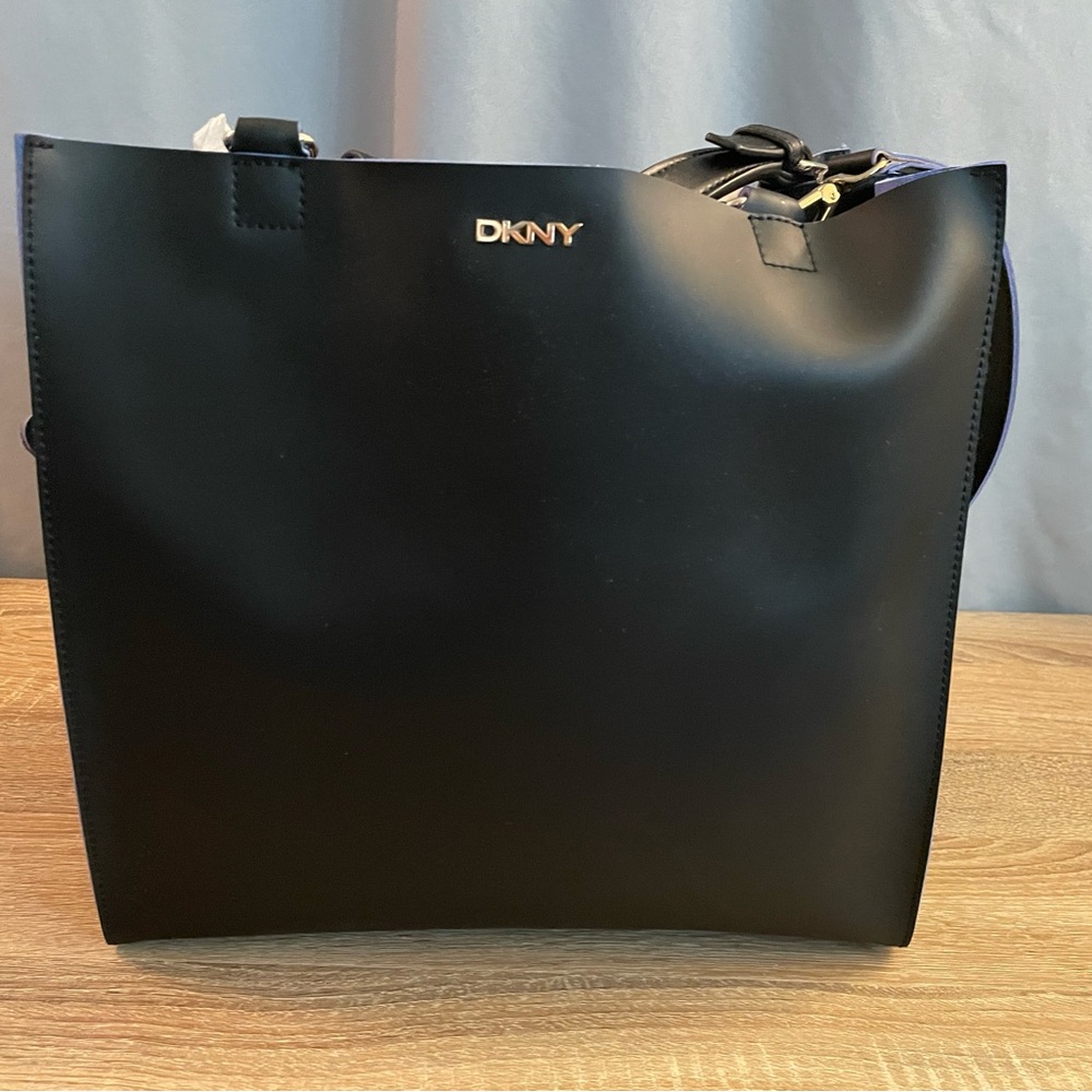 DKNY Elegant Black Tote Bag Rubberized leather tote with blue suede interior.